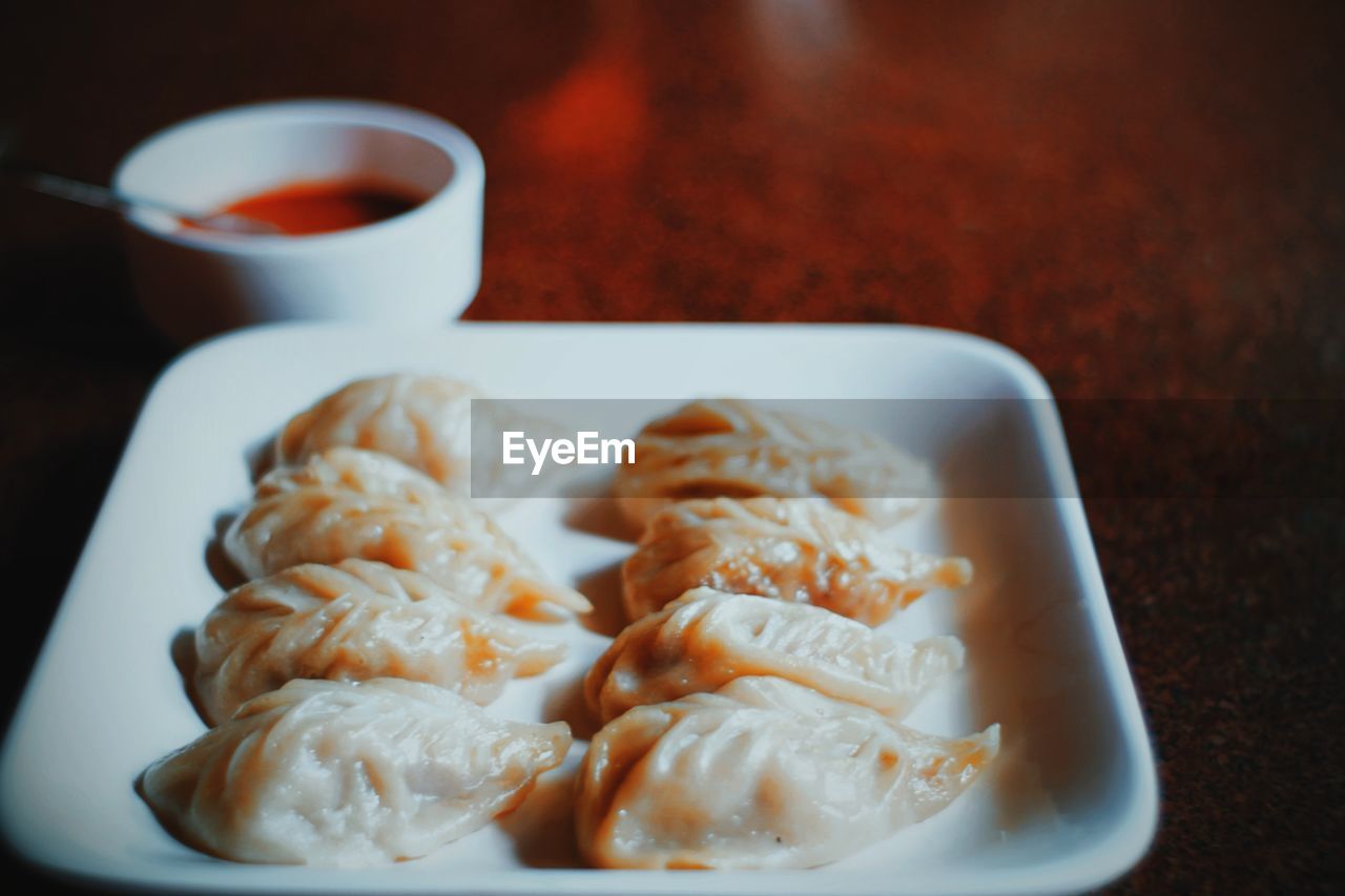 Close-up of dumplings served in plate on table