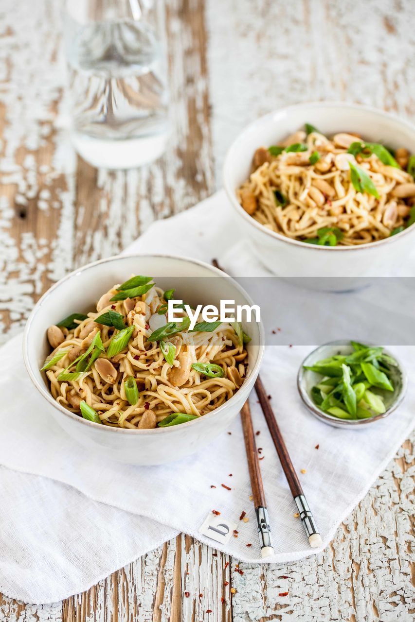 Close-up of fried noodles in bowl on table