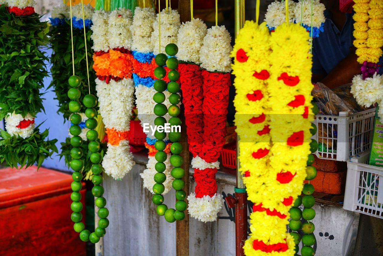 CLOSE-UP OF MULTI COLORED FLOWER POTS FOR SALE