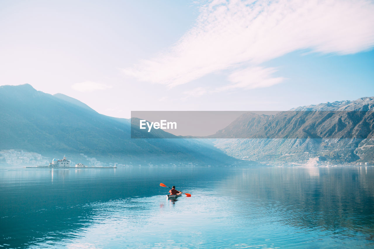 SCENIC VIEW OF LAKE AGAINST MOUNTAINS