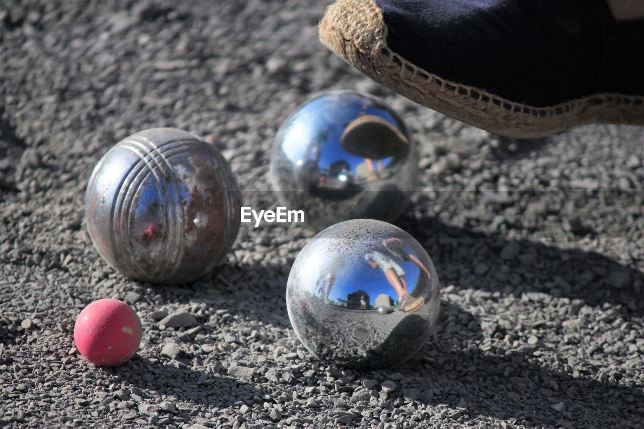 CLOSE UP OF BALL WITH SAND