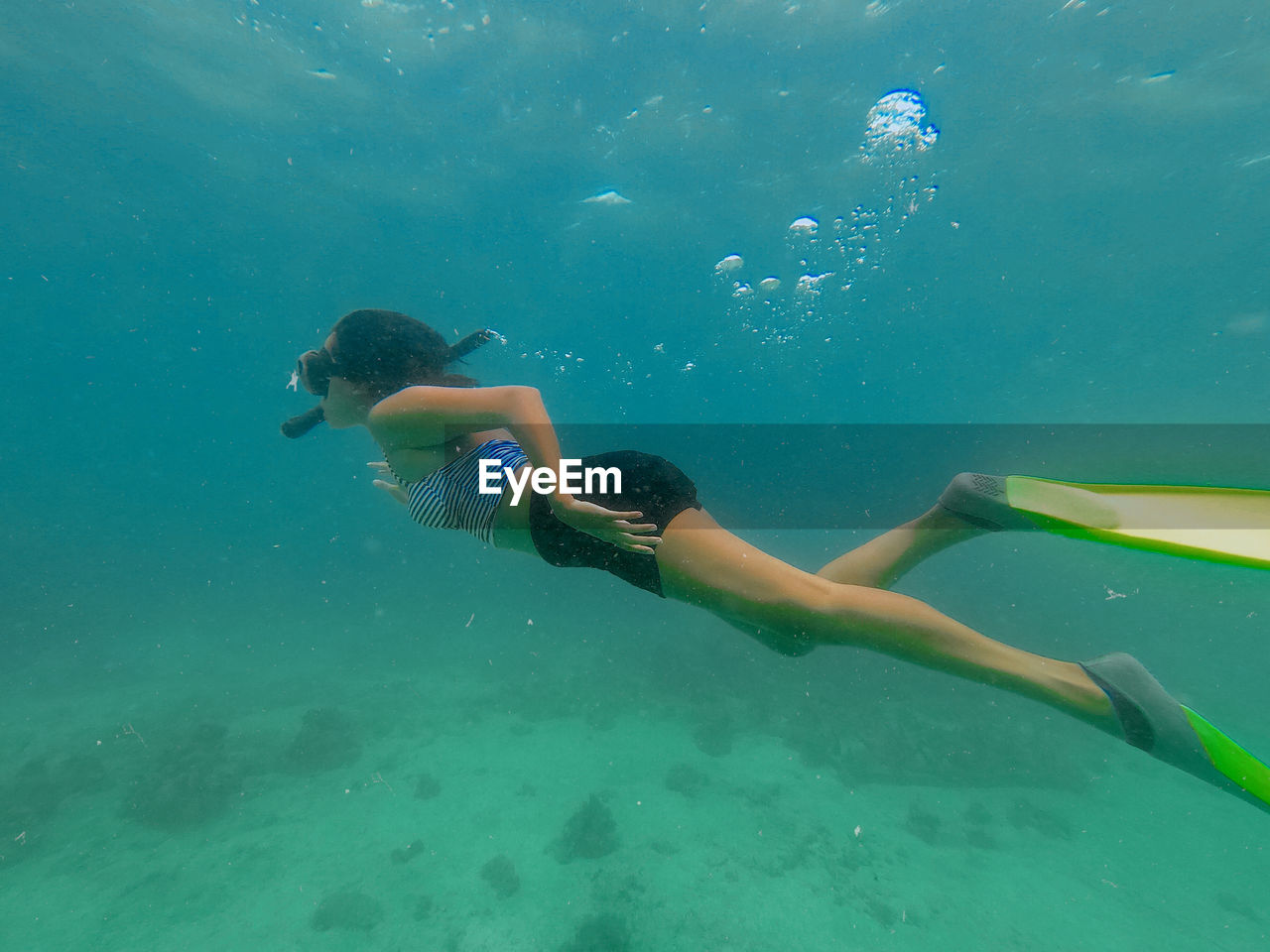 People swimming in sea