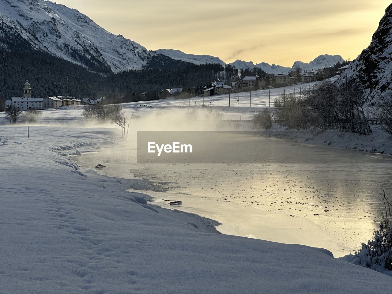 winter, snow, cold temperature, scenics - nature, mountain, environment, landscape, beauty in nature, water, sky, nature, tree, land, cloud, mountain range, reflection, travel destinations, travel, lake, tranquil scene, tranquility, frozen, forest, plant, ice, no people, coniferous tree, sunset, tourism, pinaceae, pine woodland, pine tree, non-urban scene, fog, outdoors, snowcapped mountain, mountain peak, sun, idyllic, freezing, wilderness