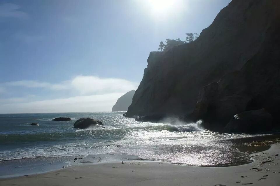 SCENIC VIEW OF SEA WITH ROCKS IN BACKGROUND