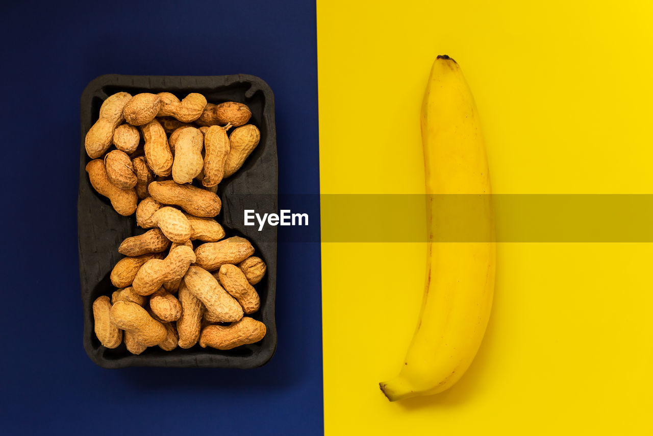 Creative layout made of peanuts and banana. flat lay. food concept.