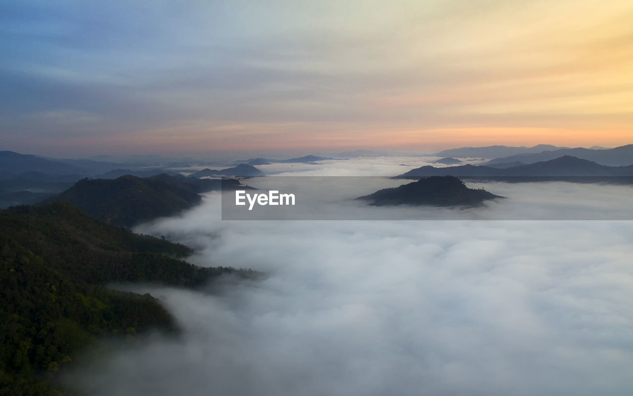 Scenic view of mountains against sky during sunset