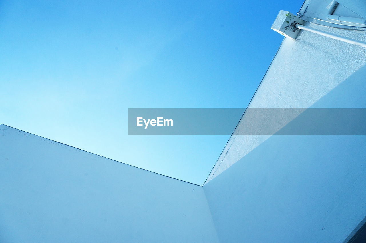 Low angle view of building against blue sky