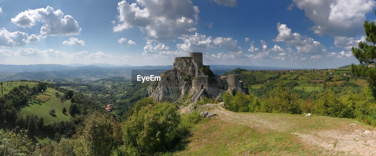 Panoramic view of trees on landscape against sky