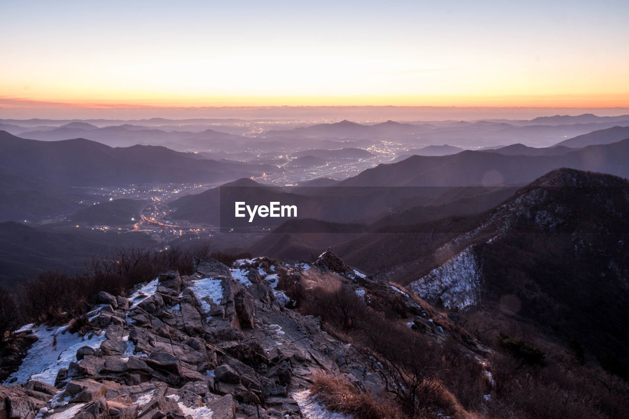 Scenic view of mountains against sky during sunset