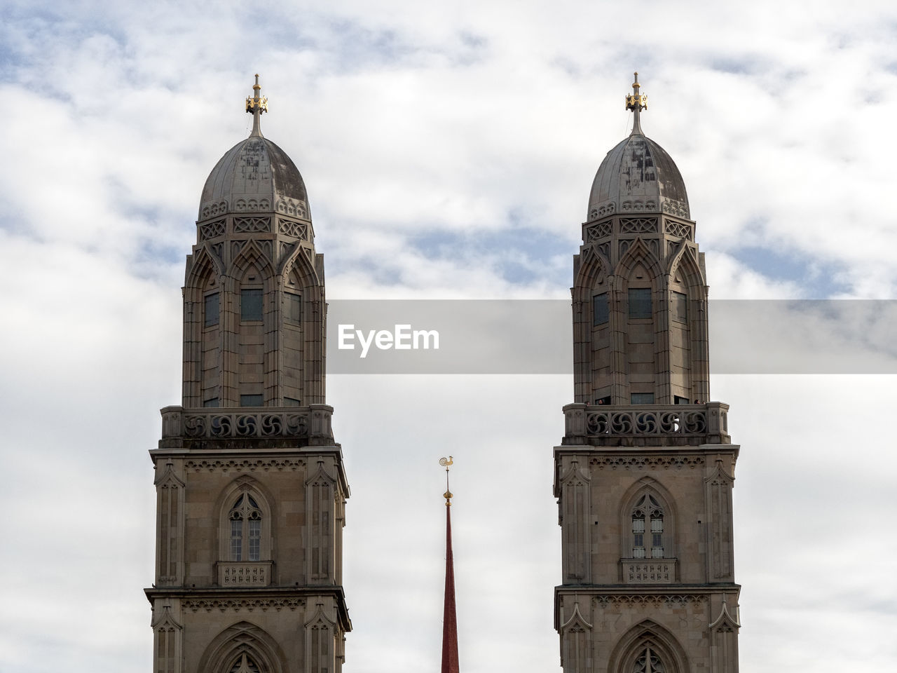 Low angle view of church against cloudy sky