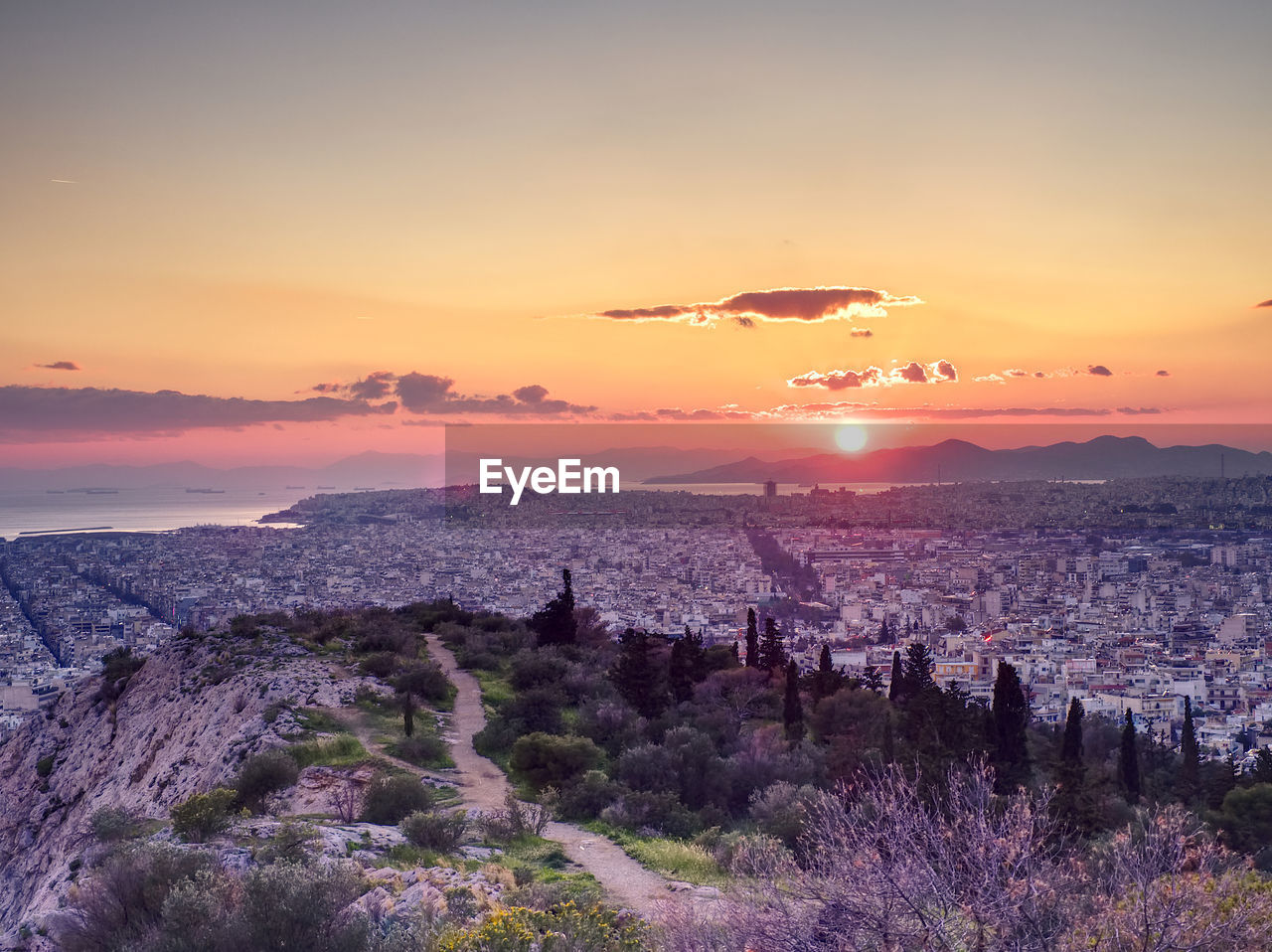 high angle view of cityscape against sky during sunset