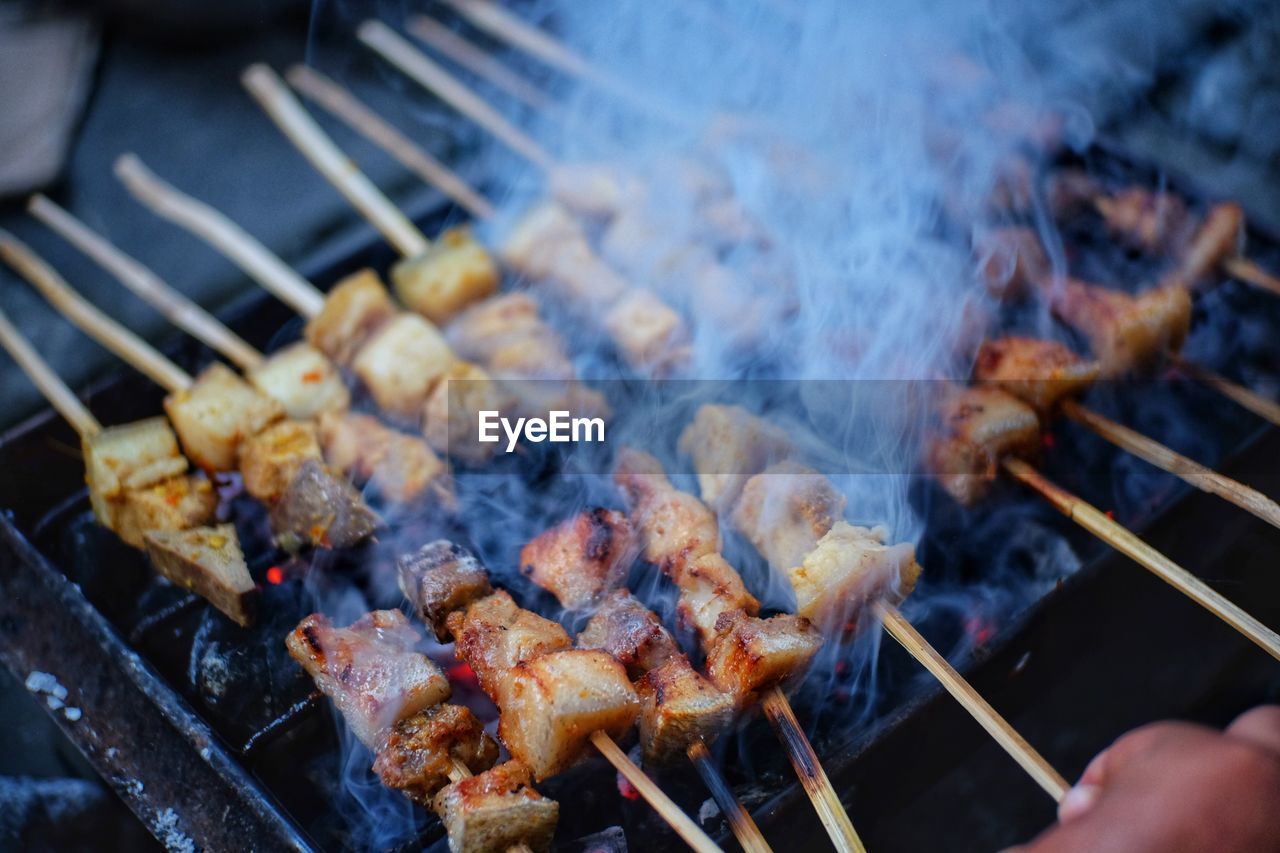 Close-up of meat on barbecue grill