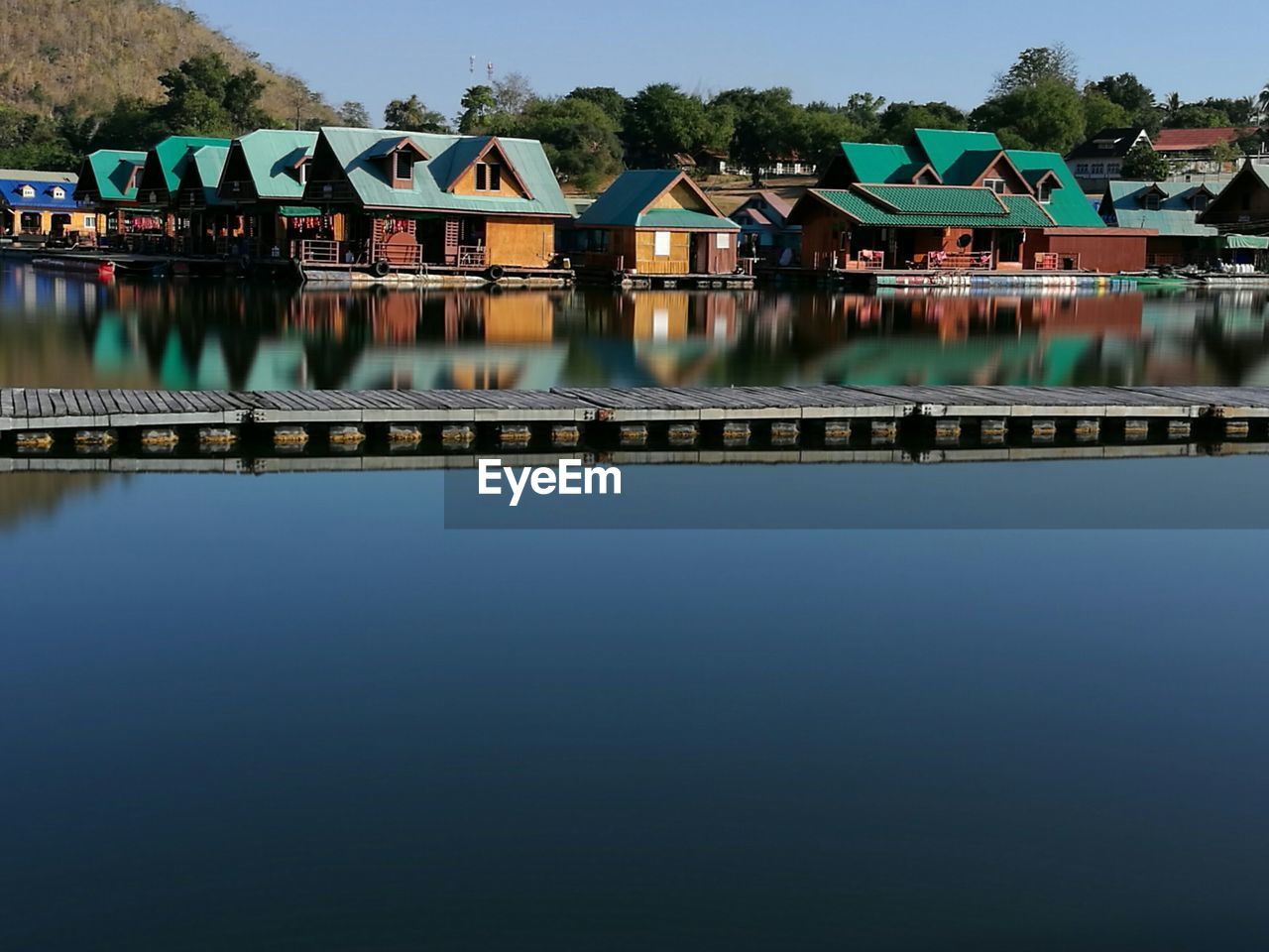 REFLECTION OF BRIDGE IN RIVER