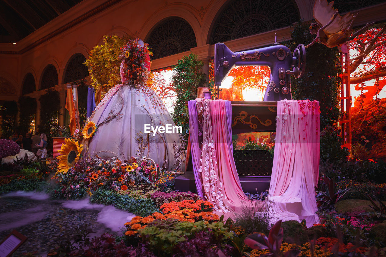 plant, flower, flowering plant, celebration, architecture, nature, decoration, built structure, ceremony, event, no people, wedding dress, religion, night, illuminated, tradition, multi colored, holiday, outdoors, lighting equipment