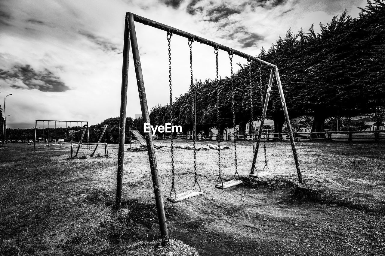 Playground in park against sky