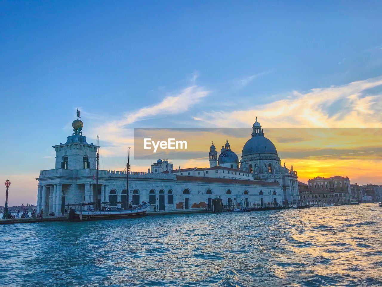 VIEW OF BUILDINGS AGAINST SKY DURING SUNSET