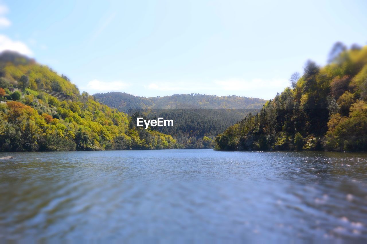 SCENIC VIEW OF RIVER AND MOUNTAINS