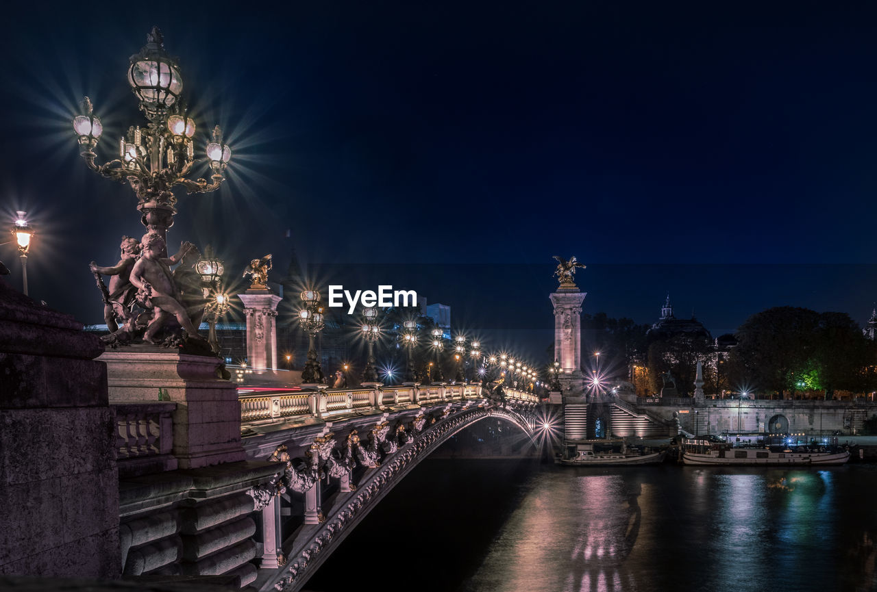 Illuminated buildings in city at night