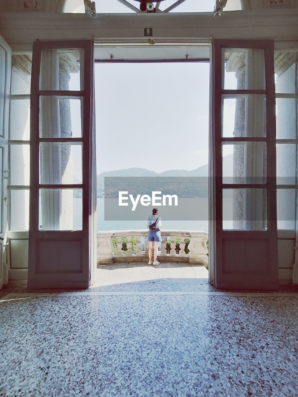 Man standing at entrance of building