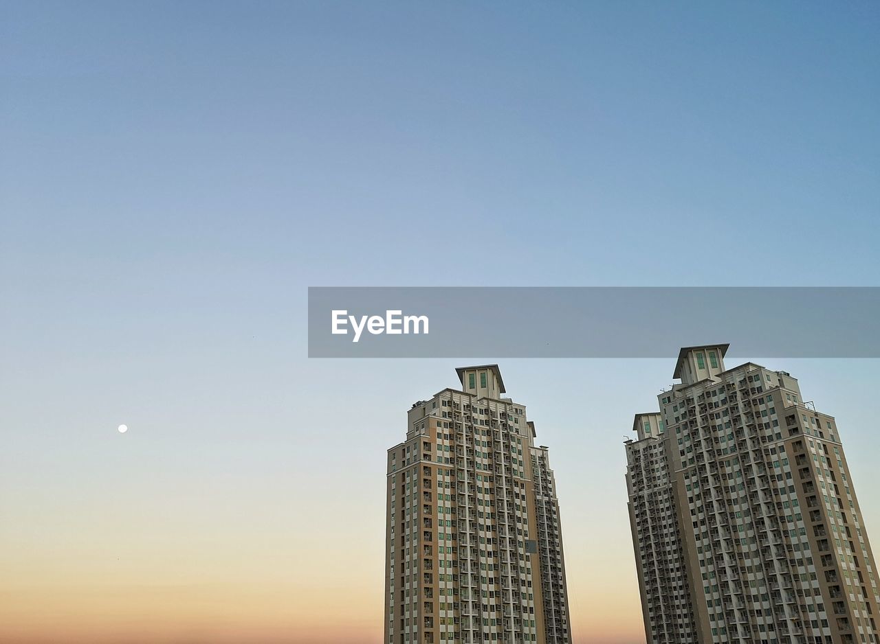 Low angle view of buildings against clear sky