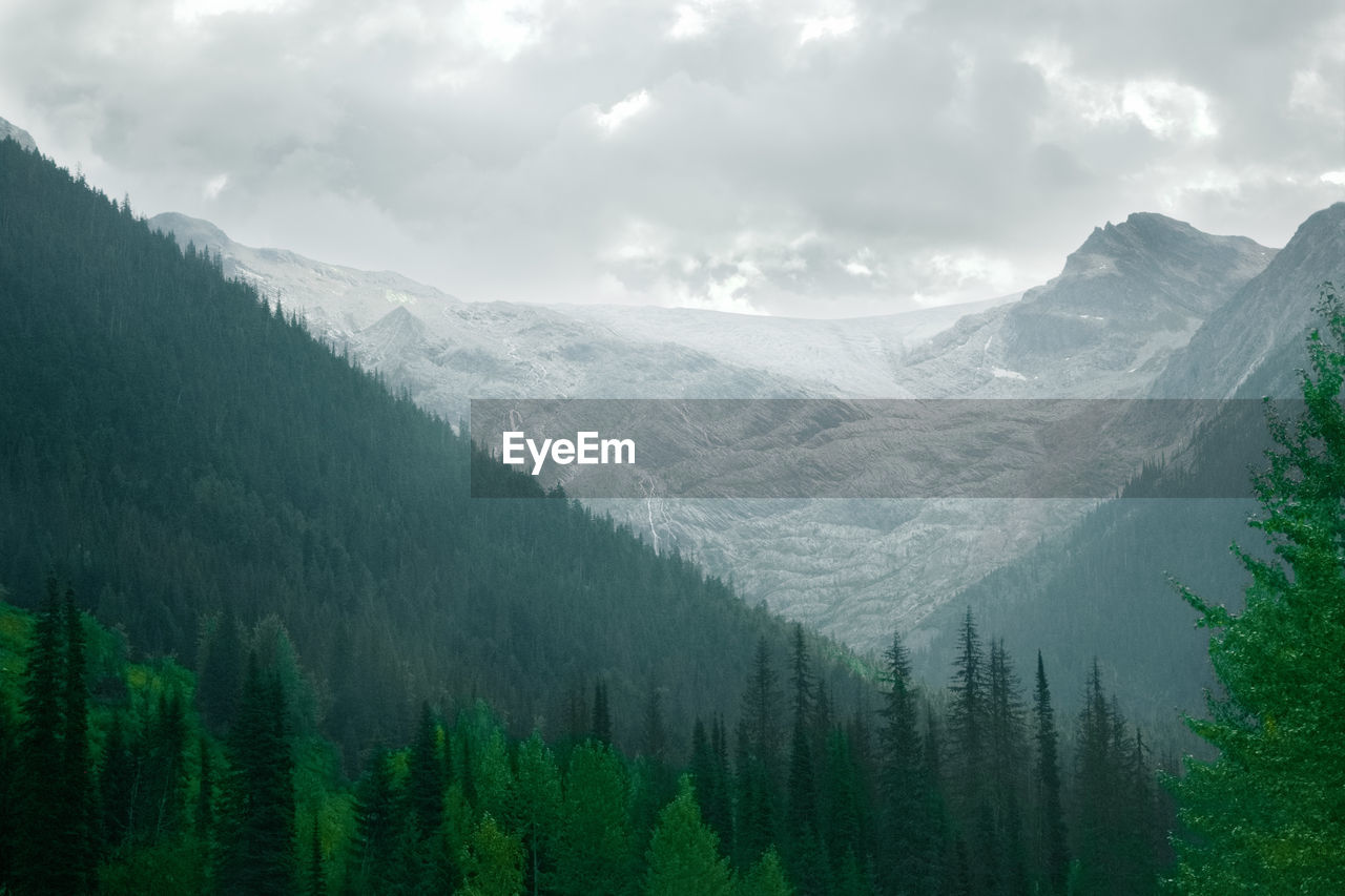 Scenic view of mountains against sky during winter