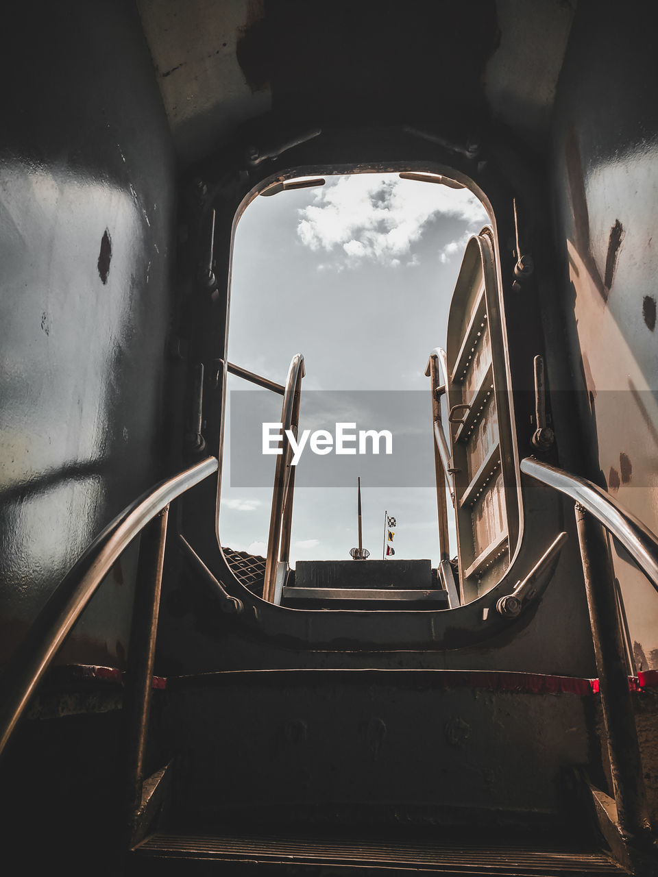 Low angle view of open door in ship