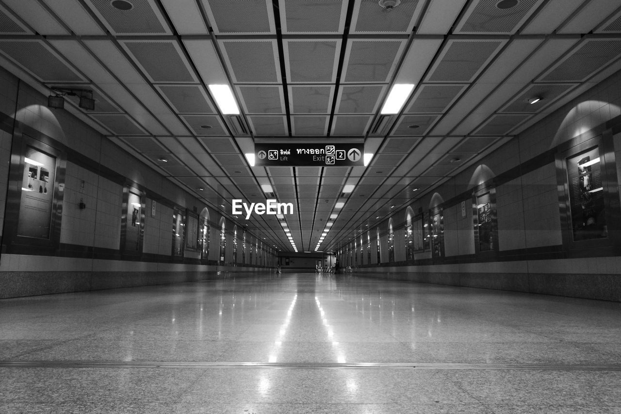 INTERIOR OF ILLUMINATED SUBWAY STATION