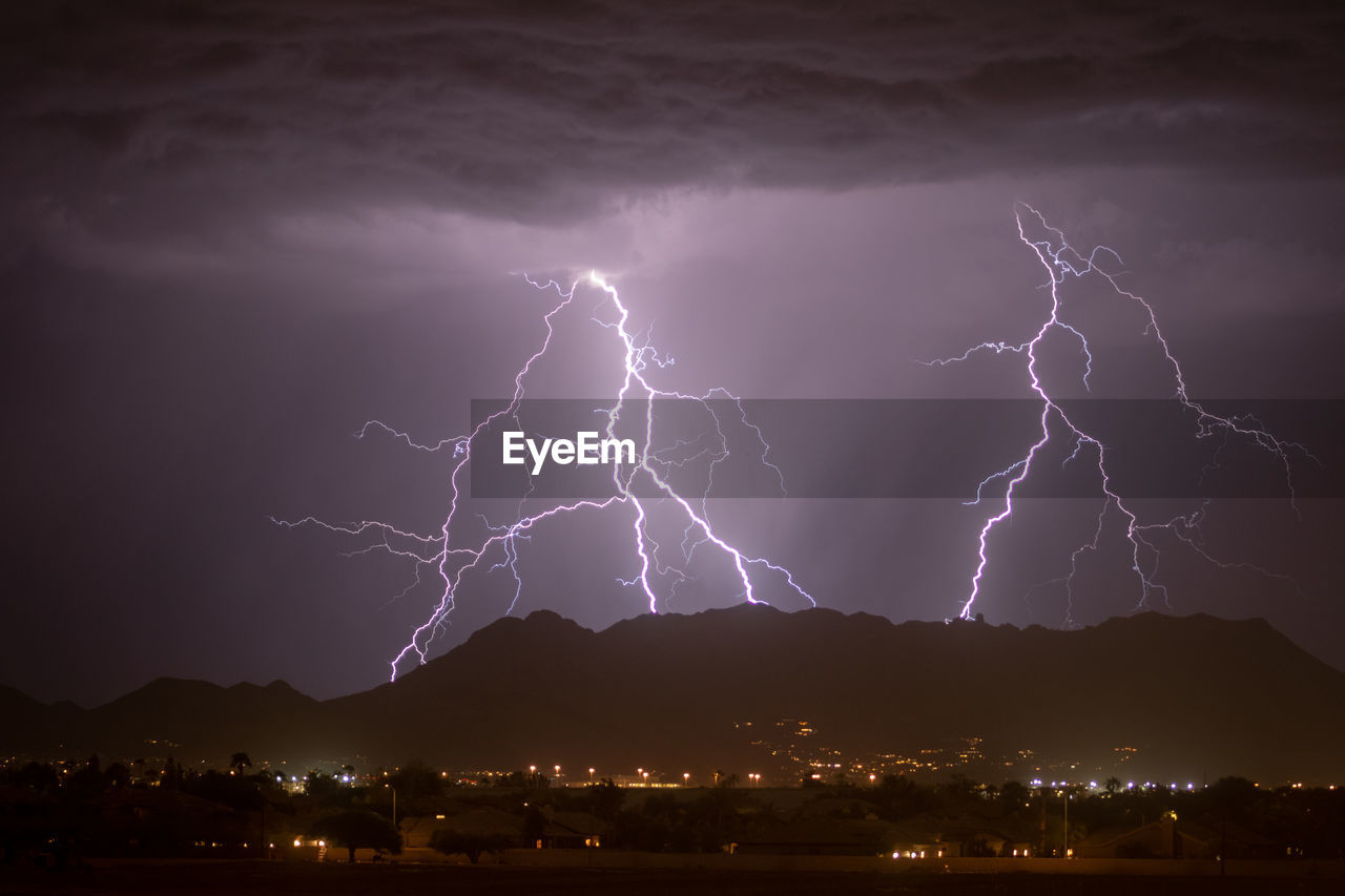 Low angle view of lightning at night