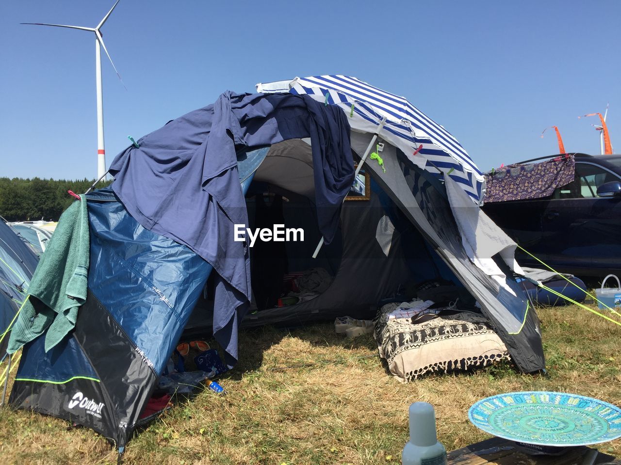 TENT ON FIELD AGAINST SKY