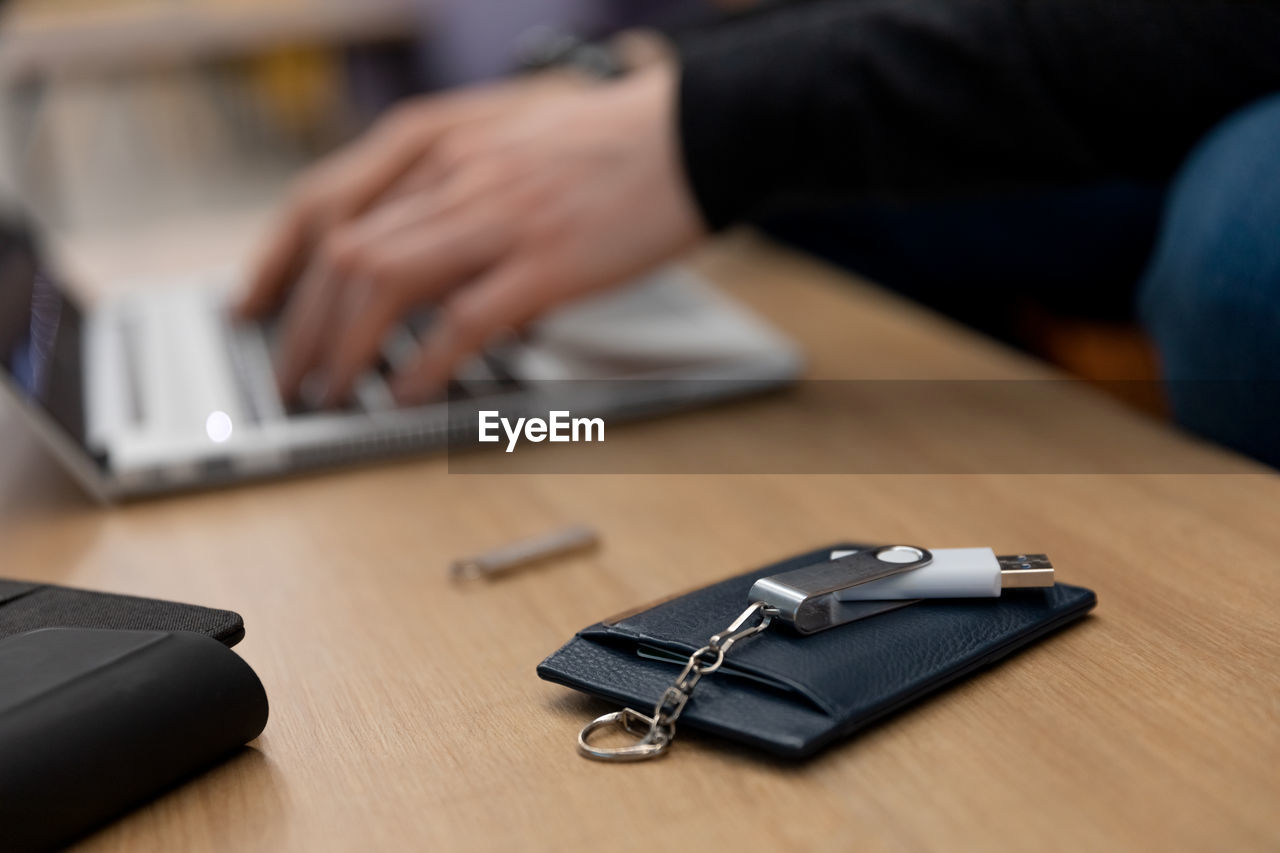 midsection of man using laptop