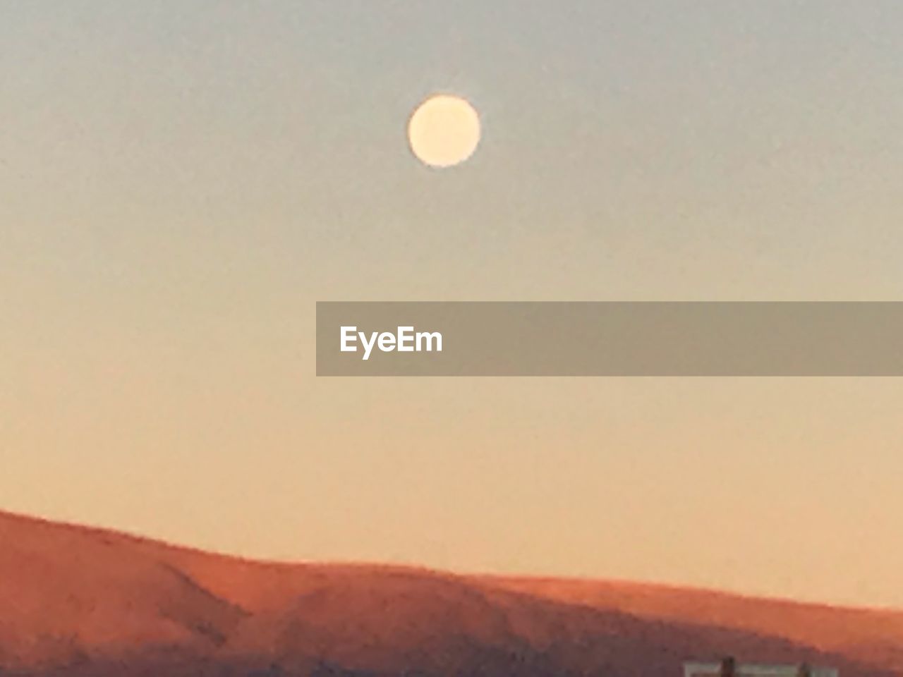 SCENIC VIEW OF MOON AGAINST SKY AT DUSK