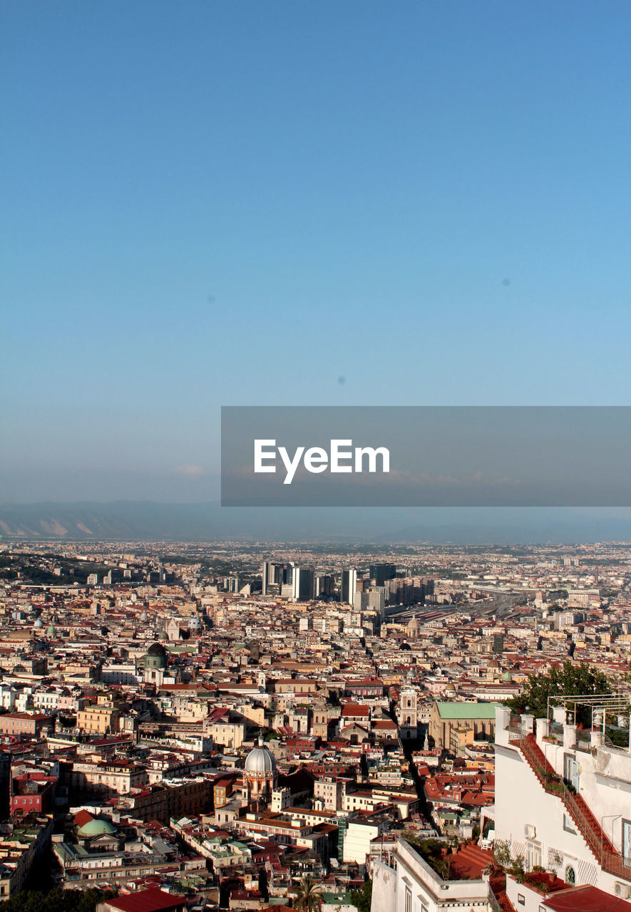 Aerial view of cityscape against sky