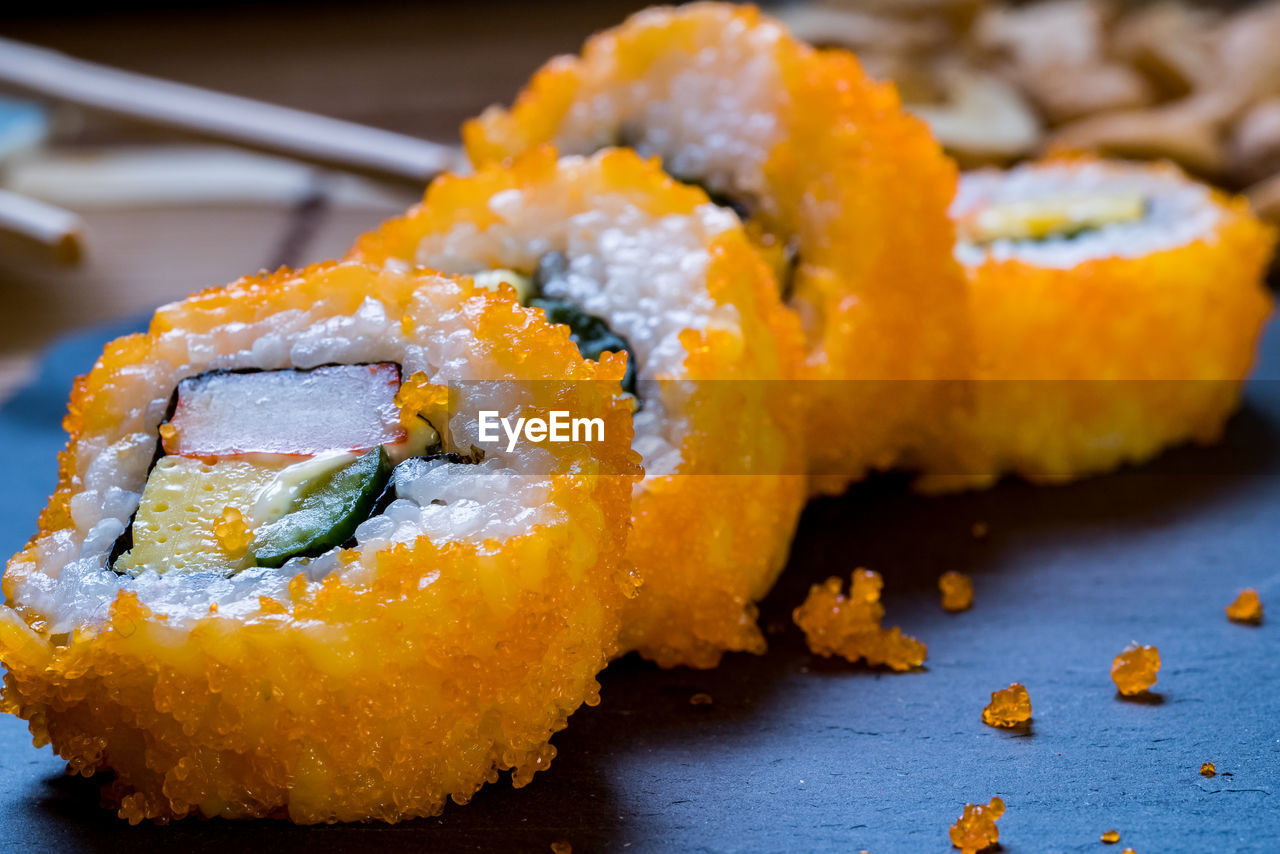 CLOSE-UP OF SUSHI SERVED ON PLATE