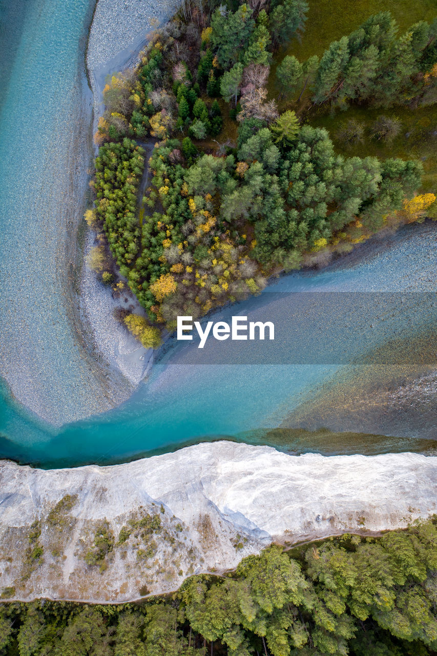 Aerial view of river amidst mountains