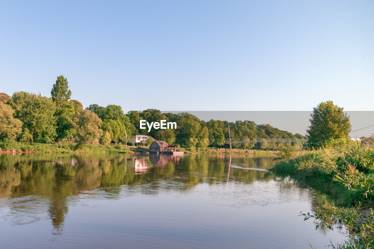 SCENIC VIEW OF LAKE AND TREES AGAINST CLEAR SKY