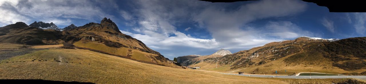 Panoramic view of landscape and mountains against sky