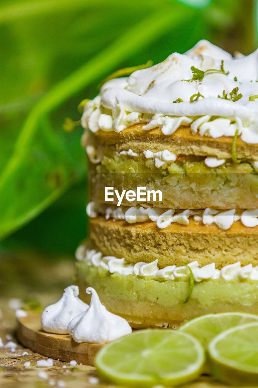 Close-up of lemon slices and cake on table