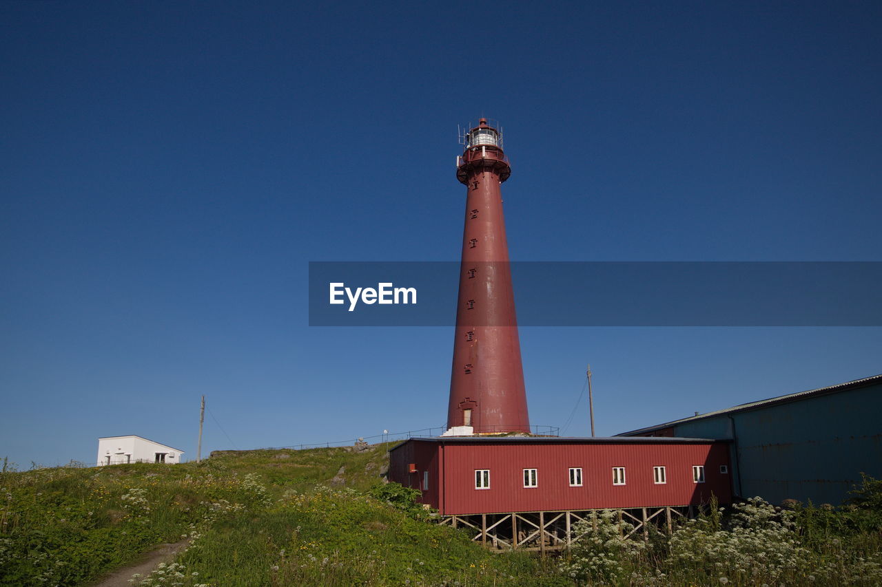 LOW ANGLE VIEW OF SMOKE STACK AGAINST CLEAR SKY