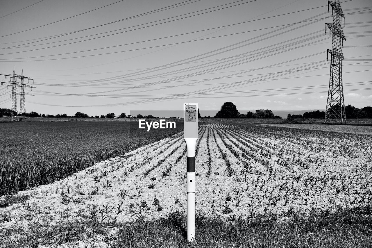 ELECTRICITY PYLON ON FIELD