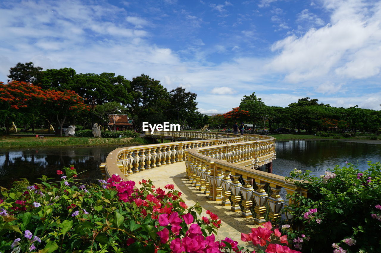 VIEW OF BRIDGE OVER LAKE AGAINST SKY