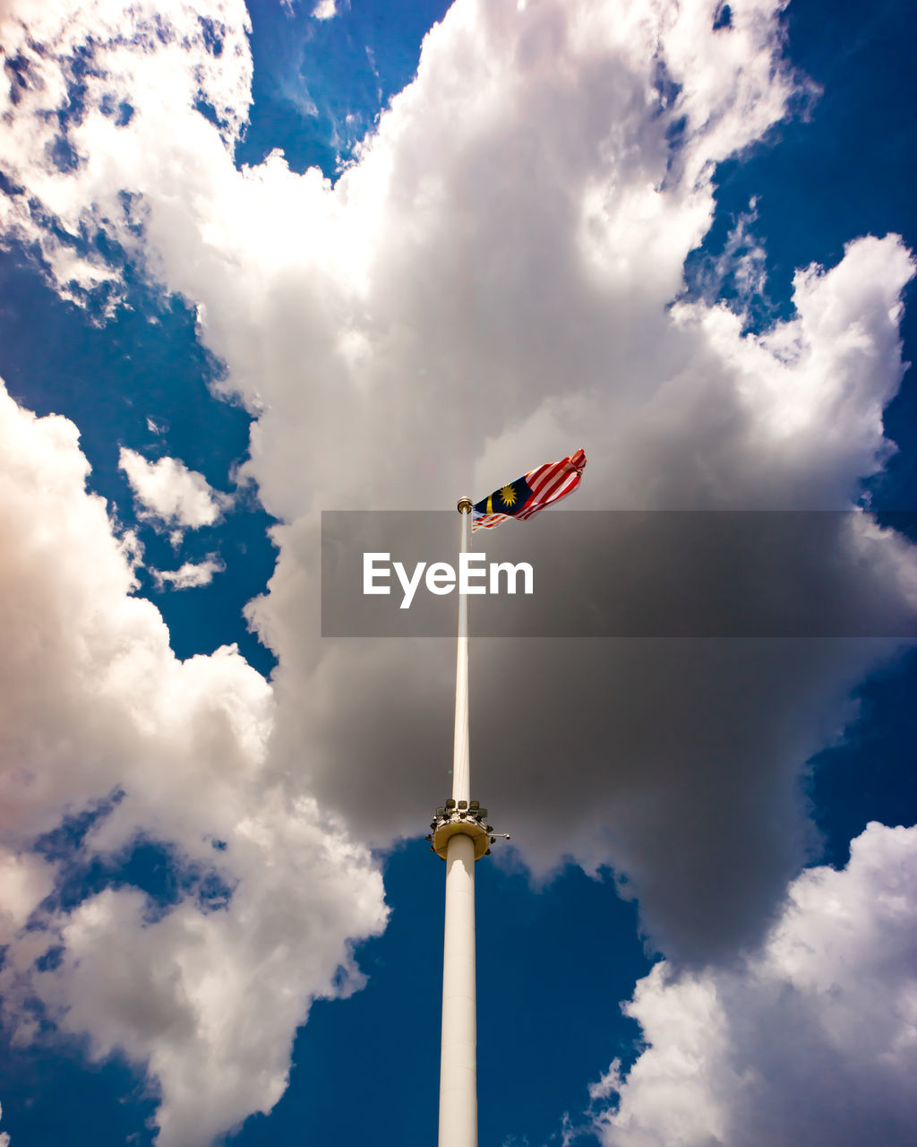 Low angle view of malaysian flag against sky