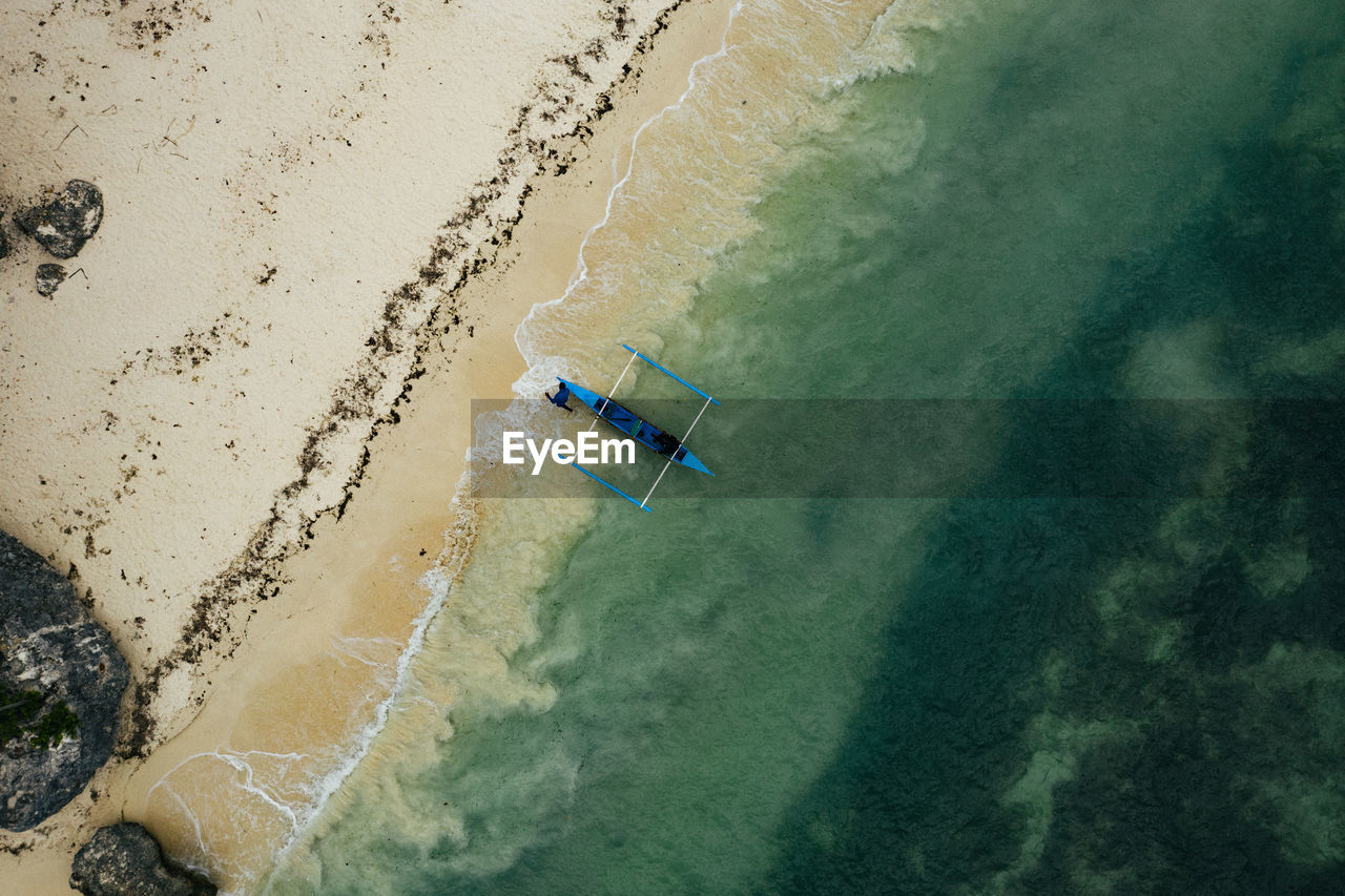 High angle view of paddle boat on beach