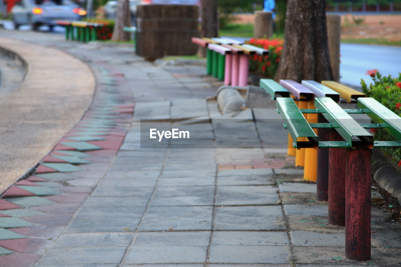 ROW OF CHAIRS ON FOOTPATH AT STREET