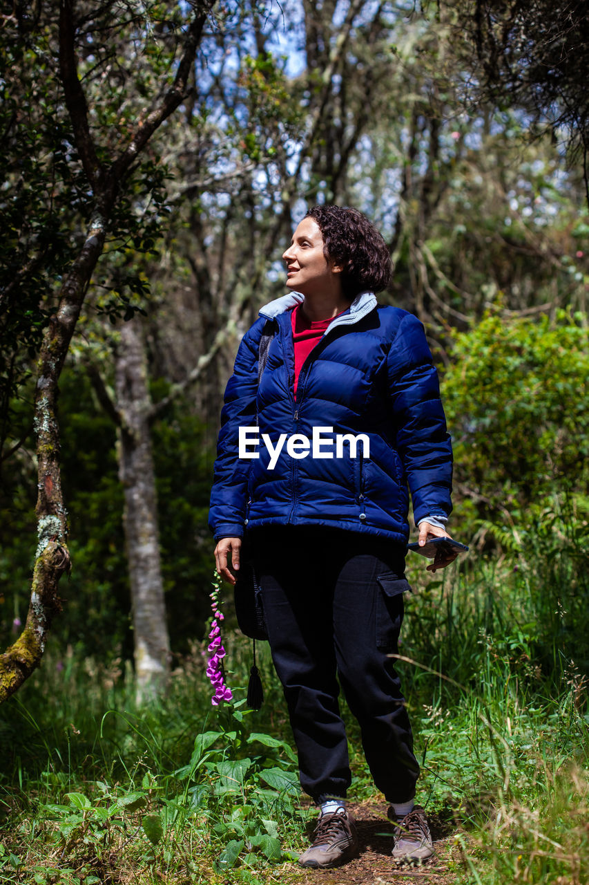 Young woman exploring the nature of a beautiful paramo at the department of cundinamarca in colombia