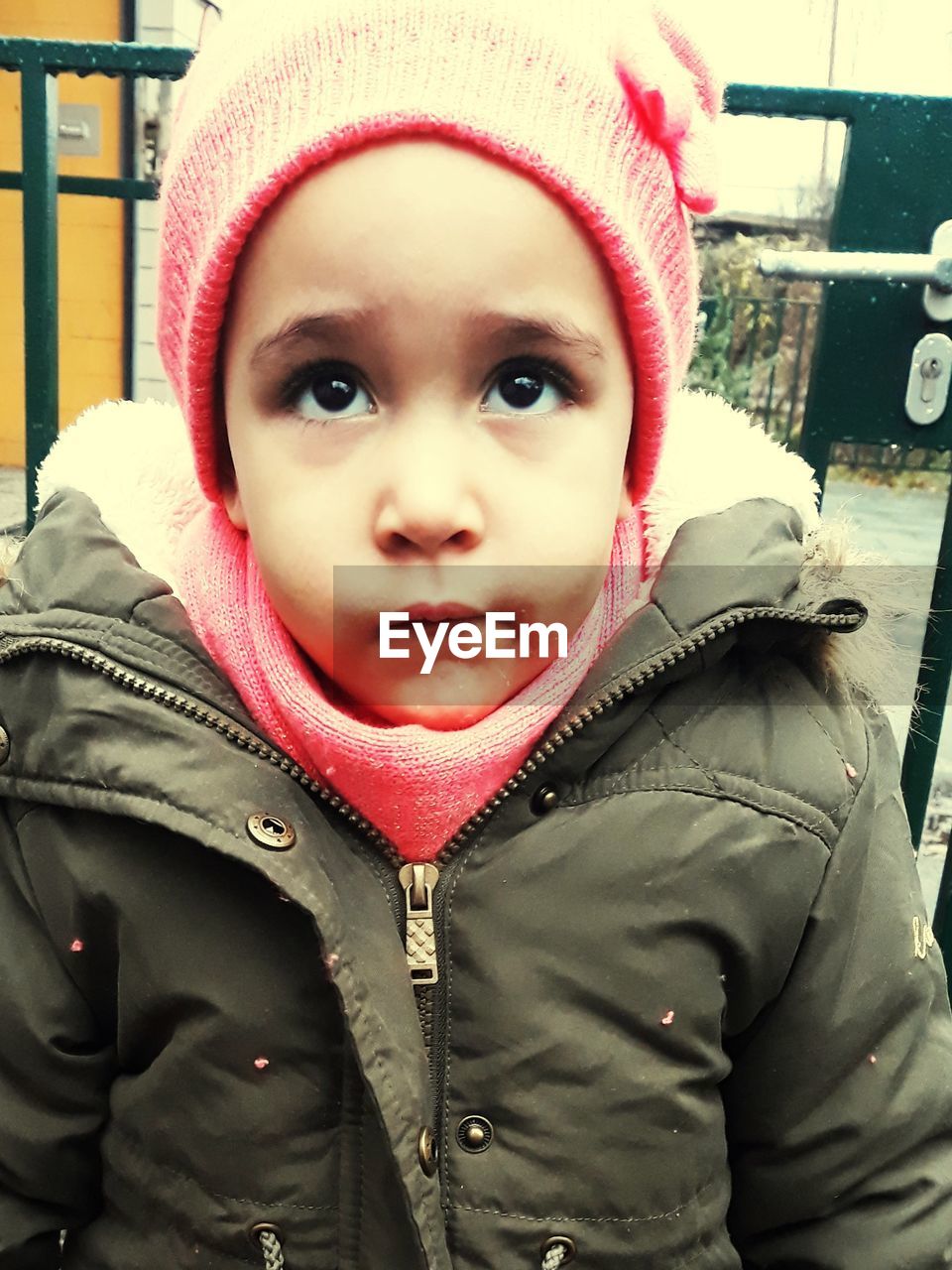 PORTRAIT OF CUTE BABY GIRL IN SNOW