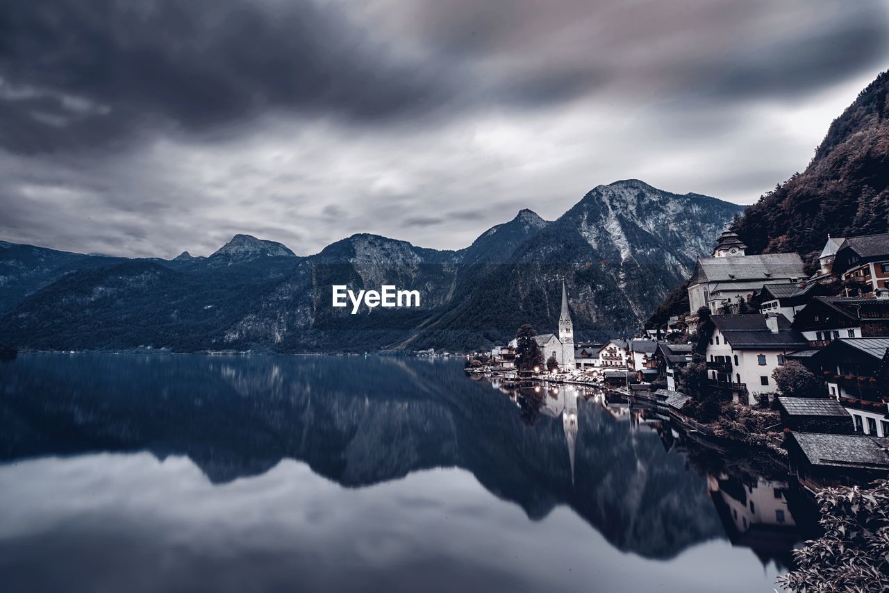 Scenic view of hallstatt and mountains reflection in hallstatter see