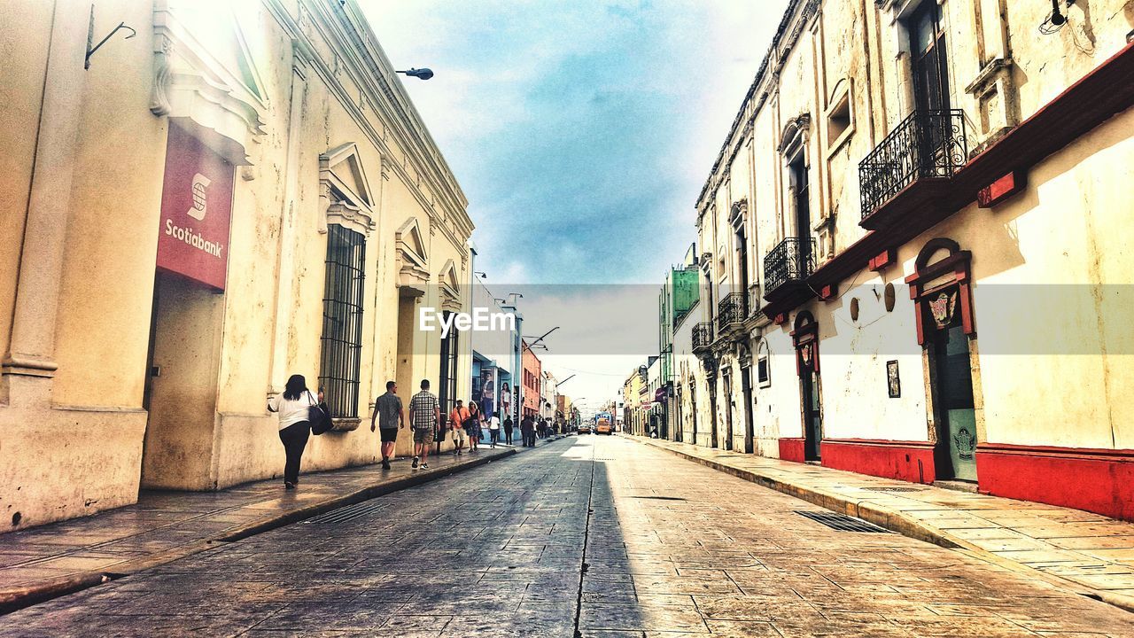 Alley amidst buildings in city