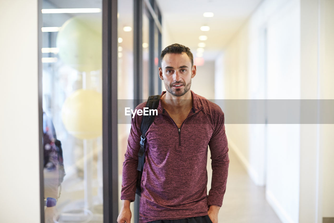 A man walking to the gym.