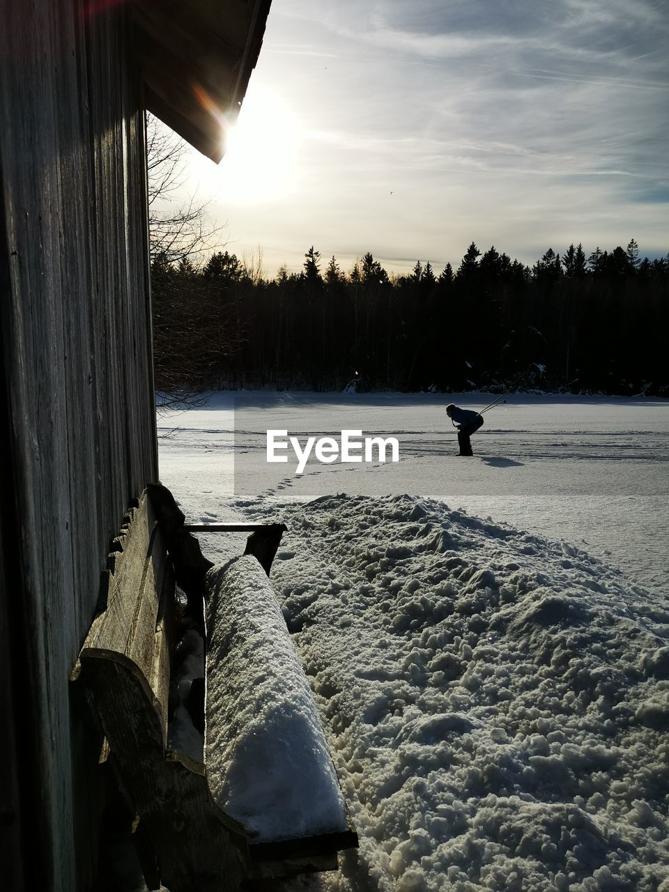 SCENIC VIEW OF SNOW COVERED LAND DURING SUNSET