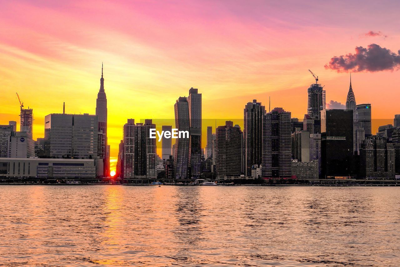 VIEW OF BUILDINGS AT SUNSET